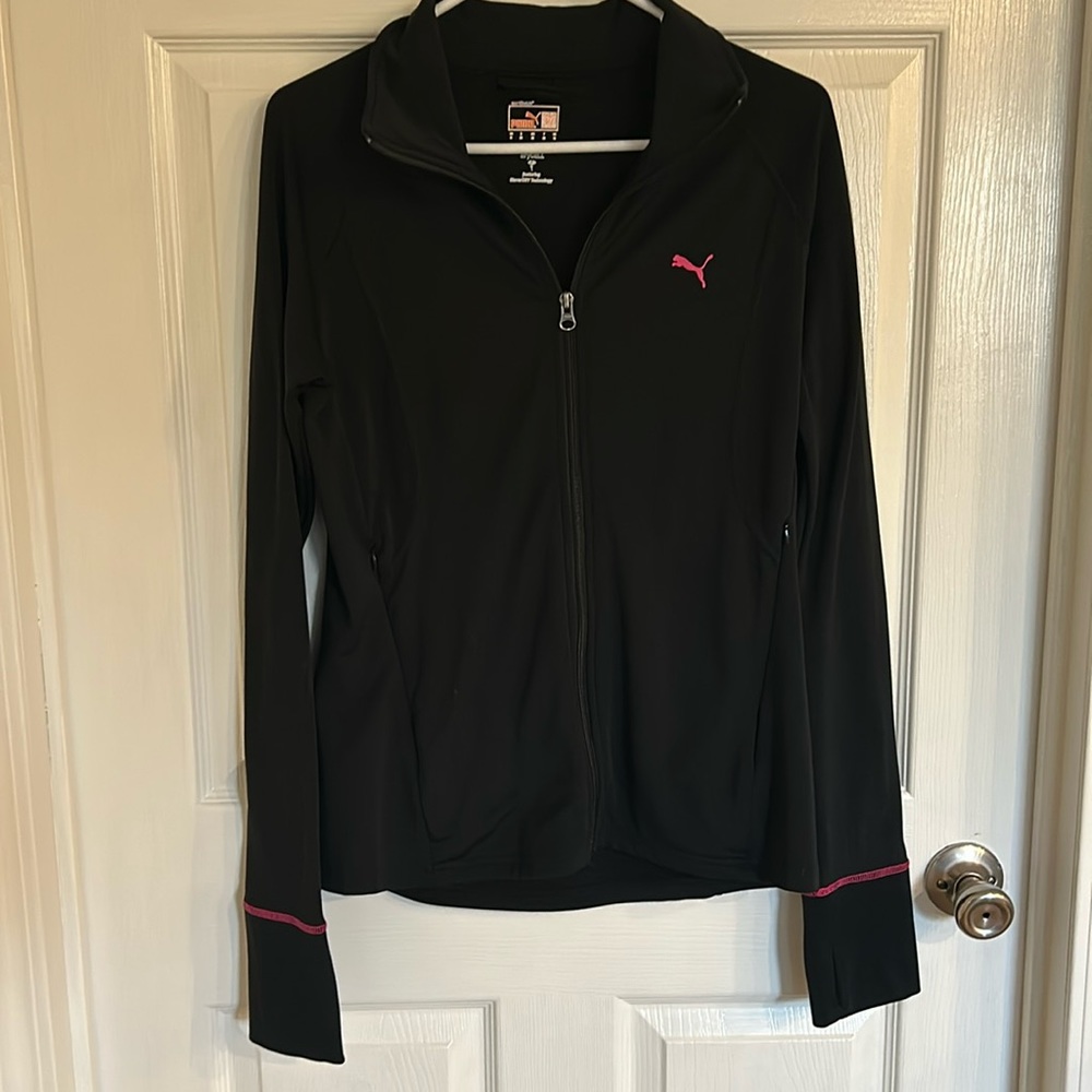 Puma jacket was zipped up pockets and thumb holes